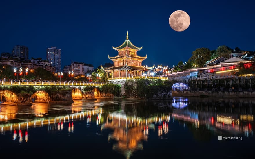 Jiaxiu Tower under a full moon, Guiyang, Guizhou province, China