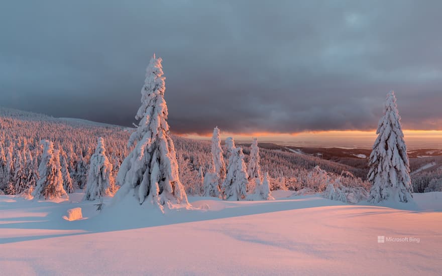 Winter scene in the mountains and setting sun, France